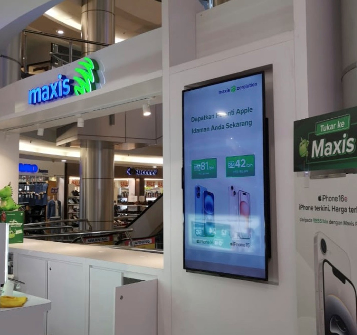 Maxis Centre storefront with digital displays