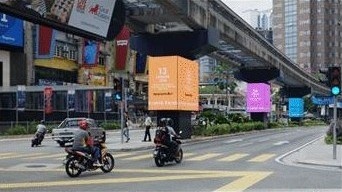 Big Tree digital screens at a city street junction